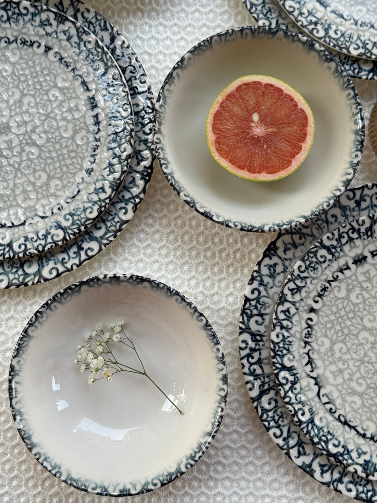 Tulu porcelain dinnerware arranged on a dining table